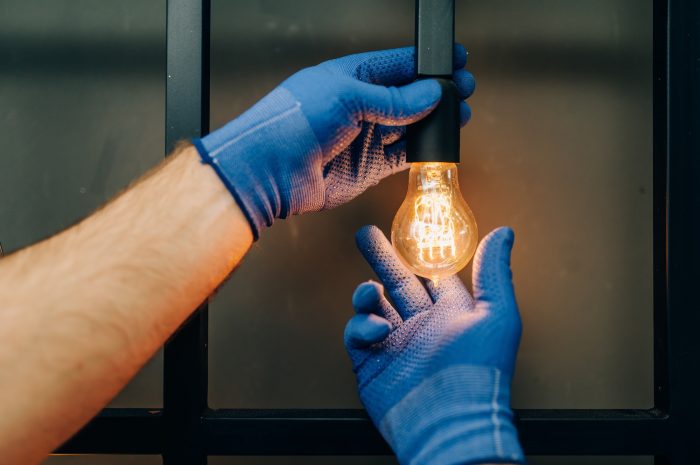 electrician-changes-the-light-bulb-handyman.jpg